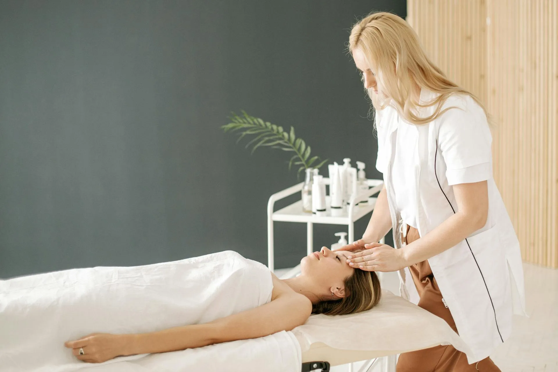 A woman receiving a relaxing massage at a massage spa.